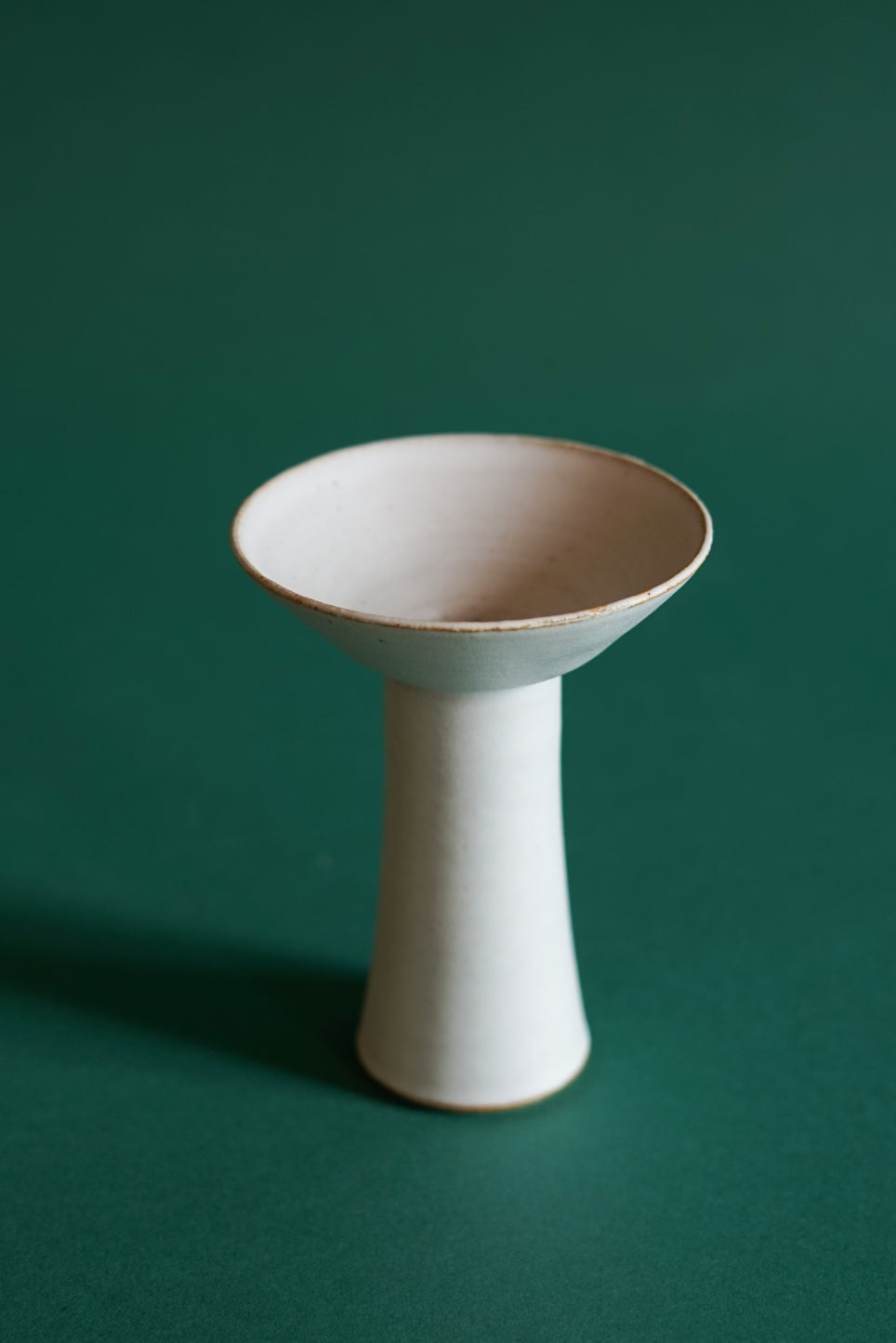 Cara Guthrie has created a collection of Midsummer Candlesticks for Bard. Pictured here is the medium size in a white chalk glaze.