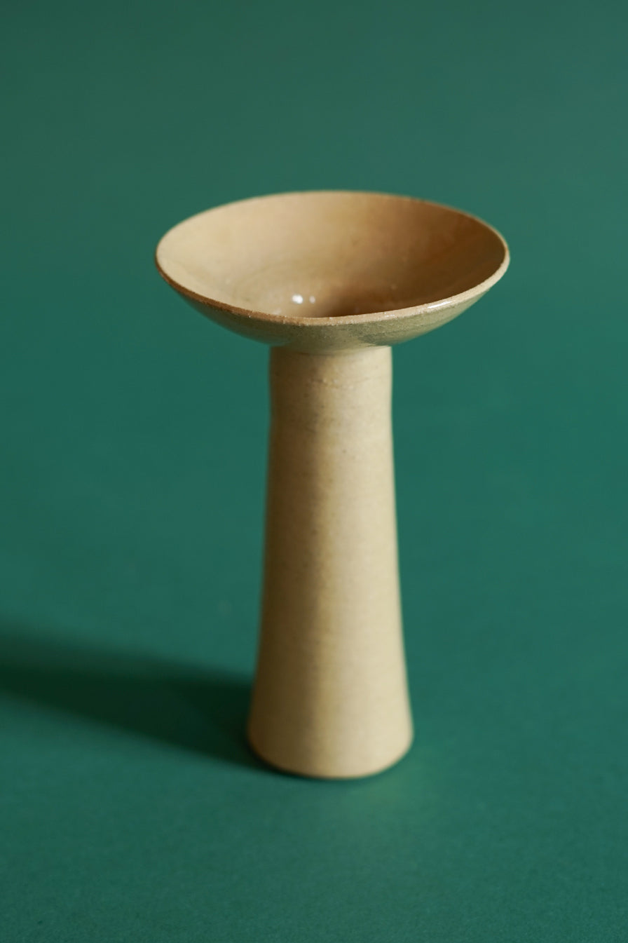 The largest of three candlesticks by Cara Guthrie in Clay.