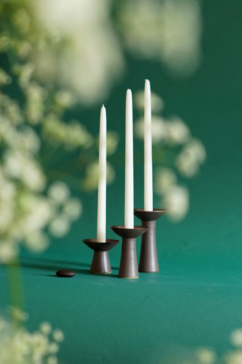 Three Iron glazed candlesticks by Cara Guthrie for Bard. Shot through the haze of cow parsley. 