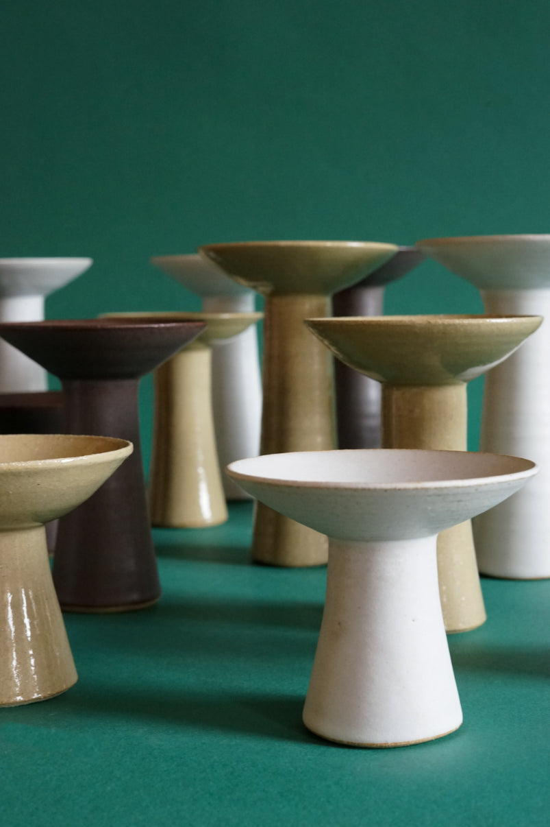 A crowd of the Cara Guthrie Midsummer Candlesticks.