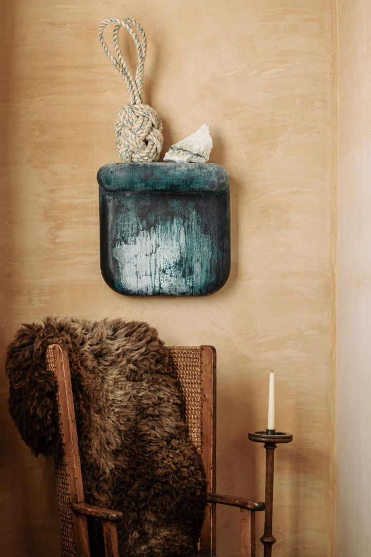  Verdigris Corbel, a textured blue ceramic sculpture by James Rigler. Used here as a shelf for other objects available at Bard Scotland.