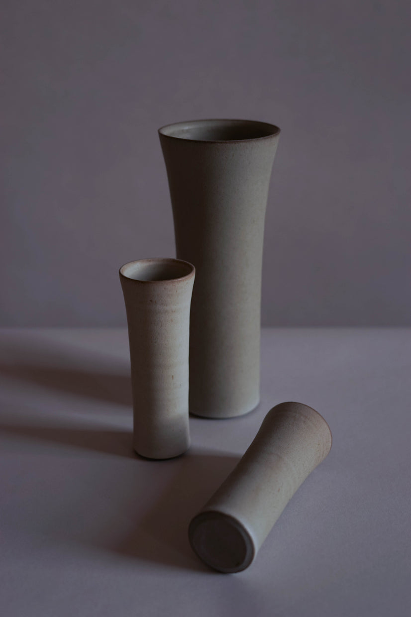 Small and large vases by Jono & Emily. In white and Bard Grey.