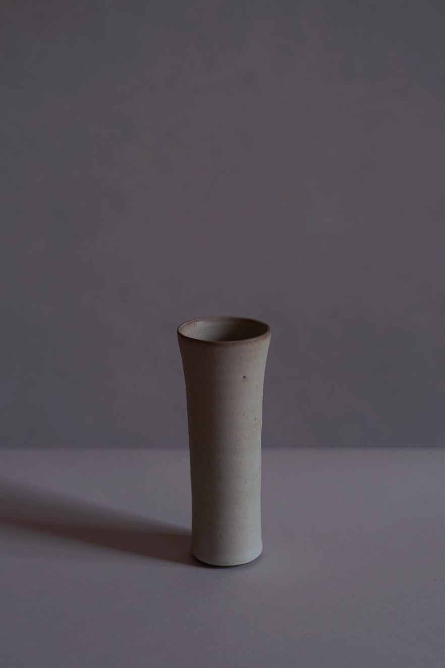 A small white vase crafted by Jono Smart & Emily Stephen.