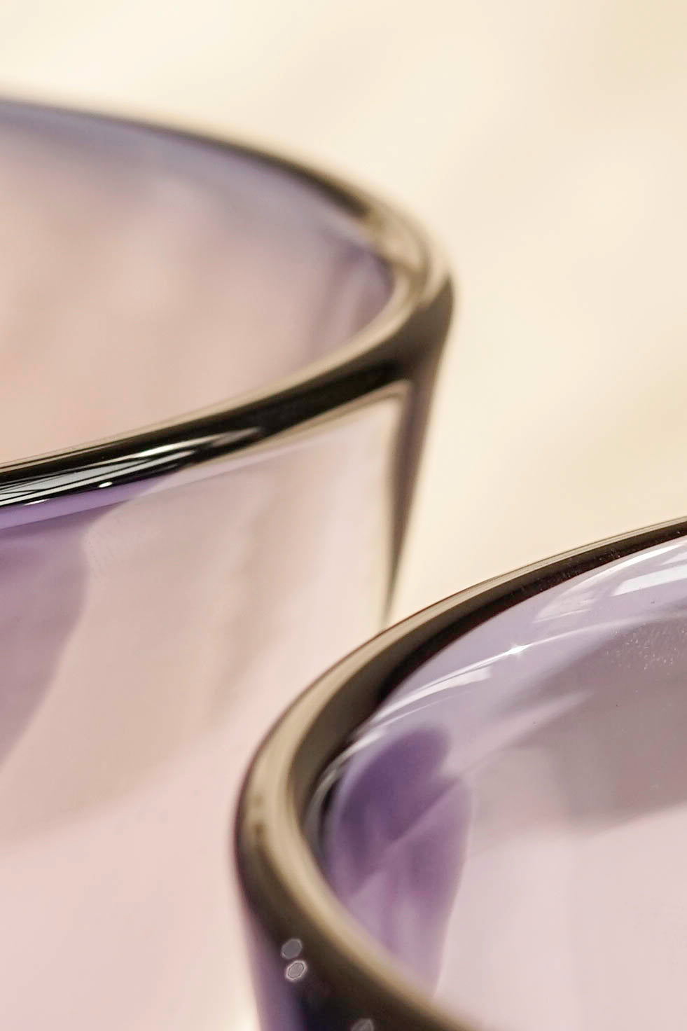 The edges of two gem glass bowls from Lindean Mill in violet.