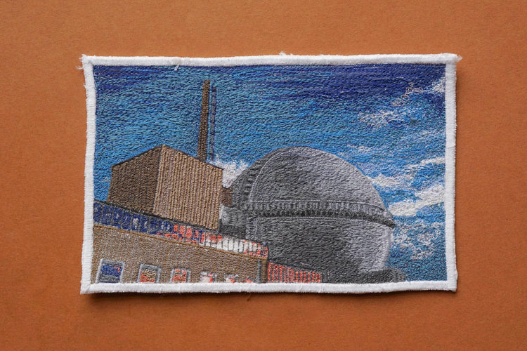  Embroidered Postcard by artist Laura Lees. This postcard depicts Dounreay Power Station.