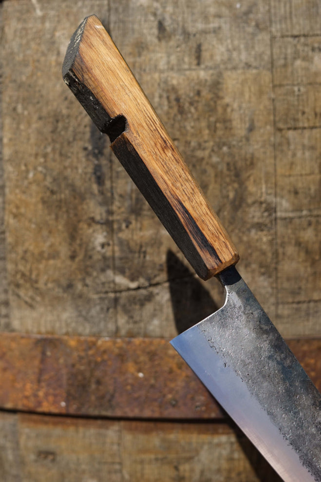 Wooden handle of the barrel chef's knife by Tim. Crafted from a decommissioned whiskey barrel.