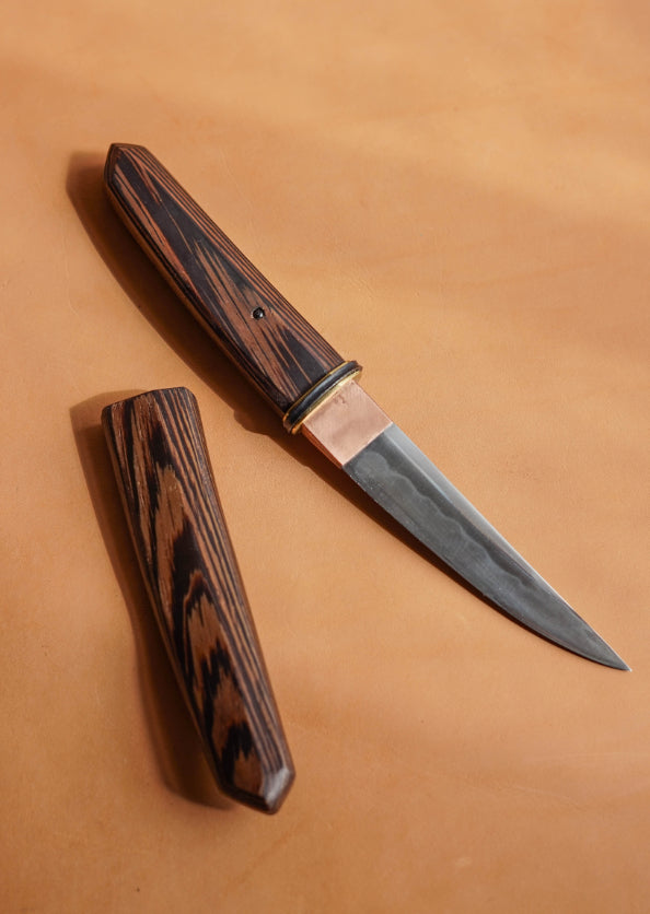Kwaiken knife forged and handmade by Jake Clelland. With a carbon steel blade and handle made from a single piece of wenge hardwood. 