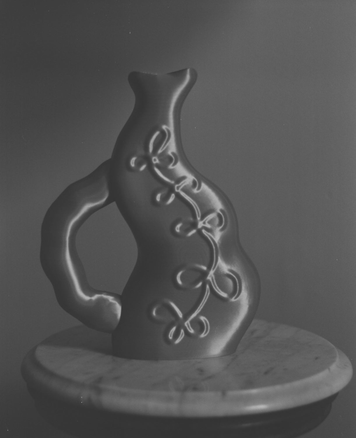 Grayscale image of the Vine Vase by Wobbly Digital Studio. 