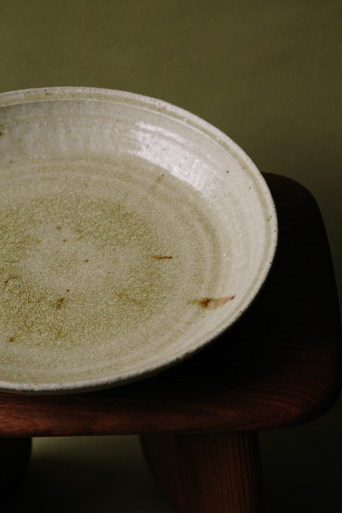 A fourth angle of the ceramic platter bathed in natural light to highlight the variety in mottling and colour across the suface of the platter.