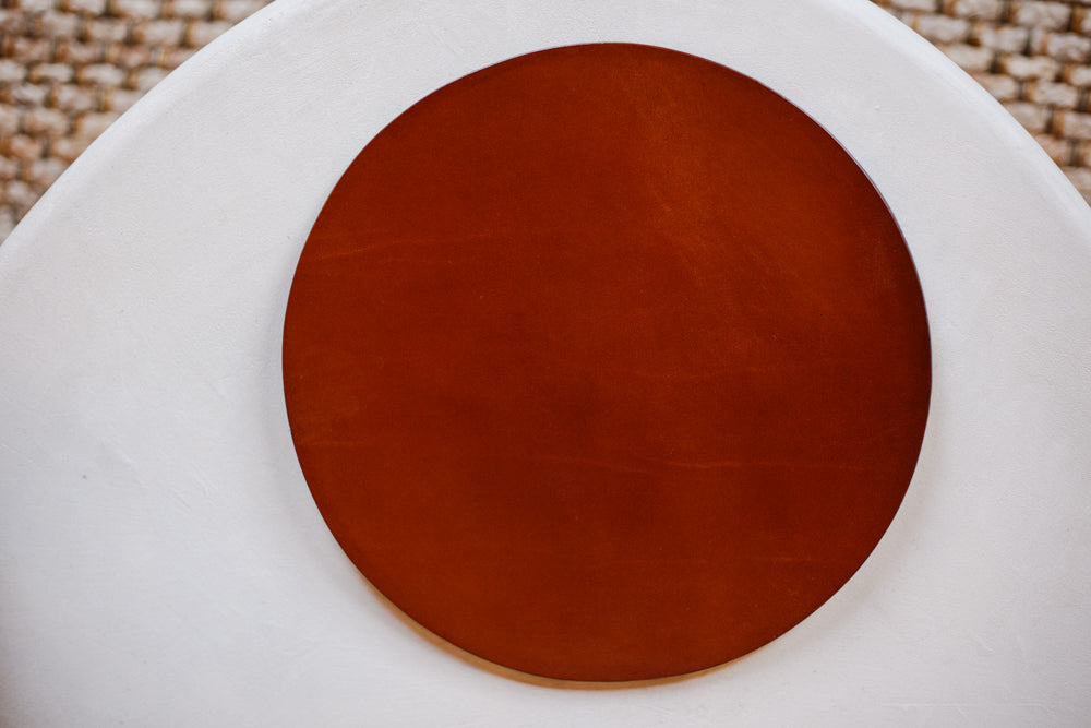 Deep tan leather placemats made from the best bridle leather by McRostie Leather of Johnstone, Scotland.