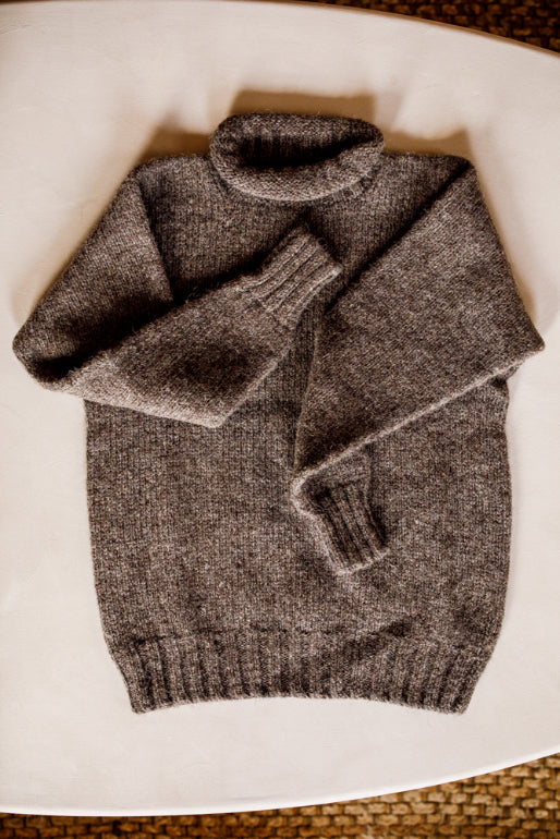 Lupetto neck jumper knitted by Shetland Woollen Co in the colour Ecology Charcoal.