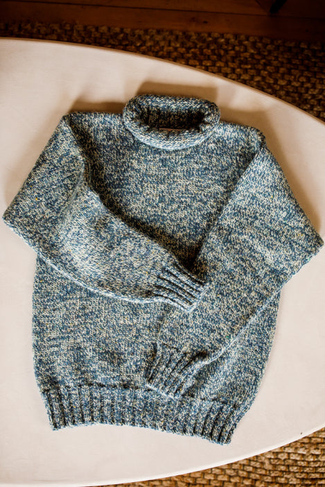 Lupetto neck jumper knitted by Shetland Woollen Company in Blue Marl.