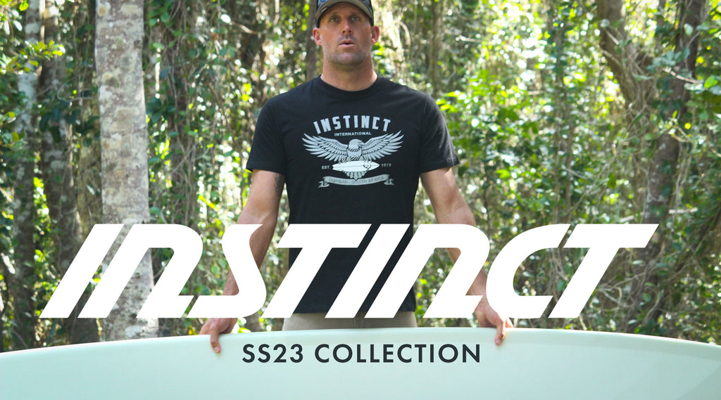 Instinct SS23 International Collection: header image of surfer Taylor Jensen holding his surfboard.