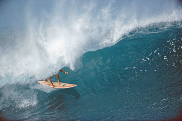 Photo by Dan Merkel 1975. Surfer catching a wave.