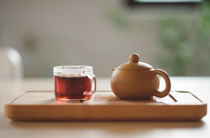 black tea and teacup on tray