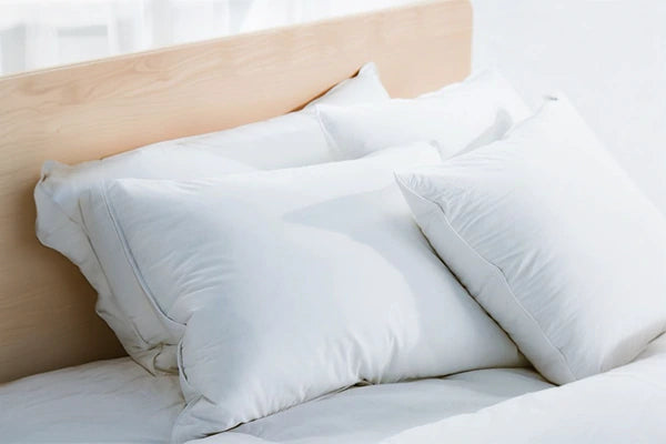 Close-up of down pillow inserts showcasing their fluffy texture.