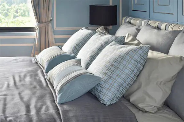 Euro pillow inserts arranged on a bed, showcasing their elegance and support.