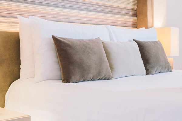 Euro pillow inserts arranged neatly on a bed.