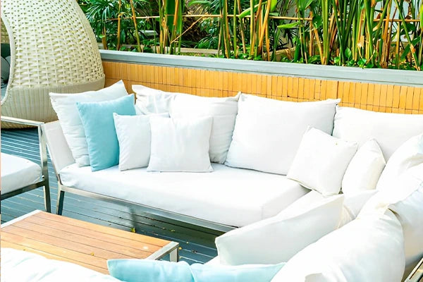 Patio furniture with foam pillow inserts.