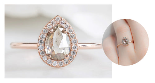 rose gold engagement ring featuring a rose-cut salt and pepper diamond with a white diamond pavé halo