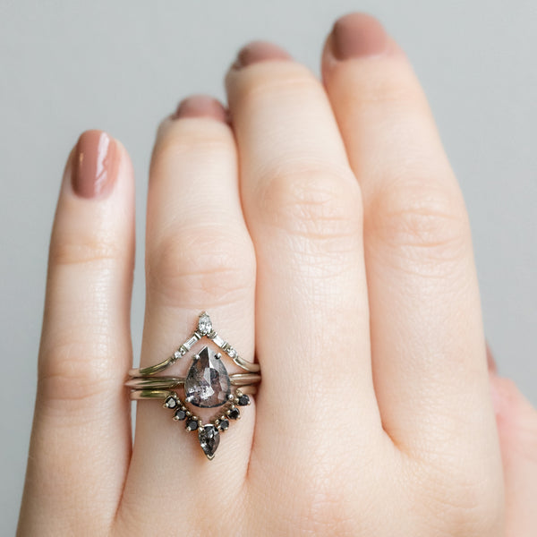 Black Diamond Engagement Ring Stacked with Wedding Bands on Model