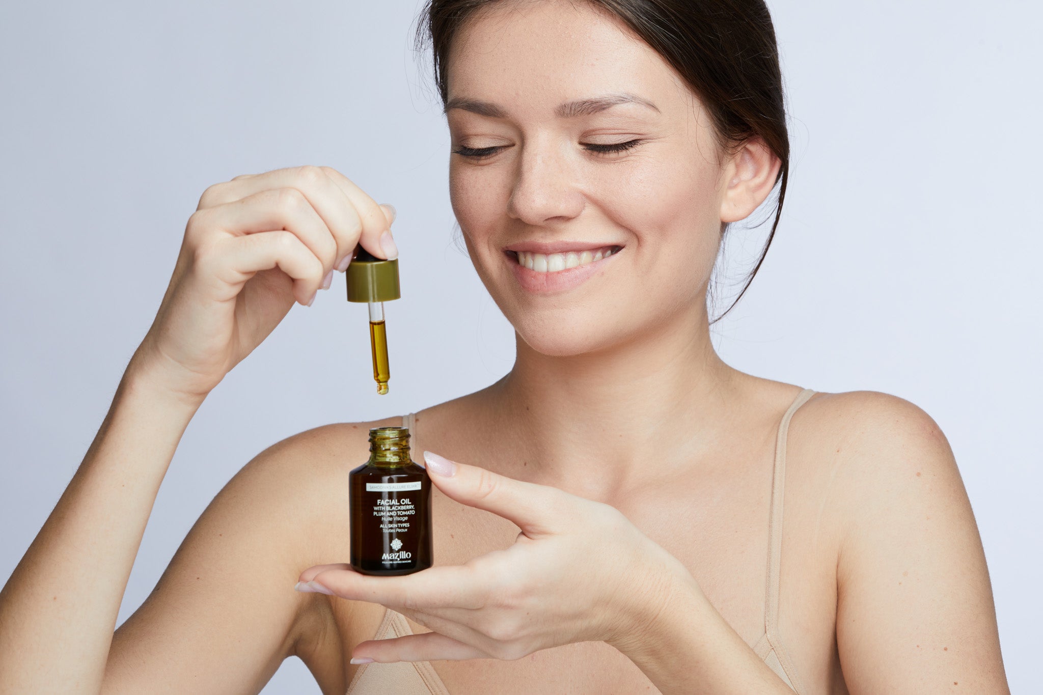 Model applying Facial Oil