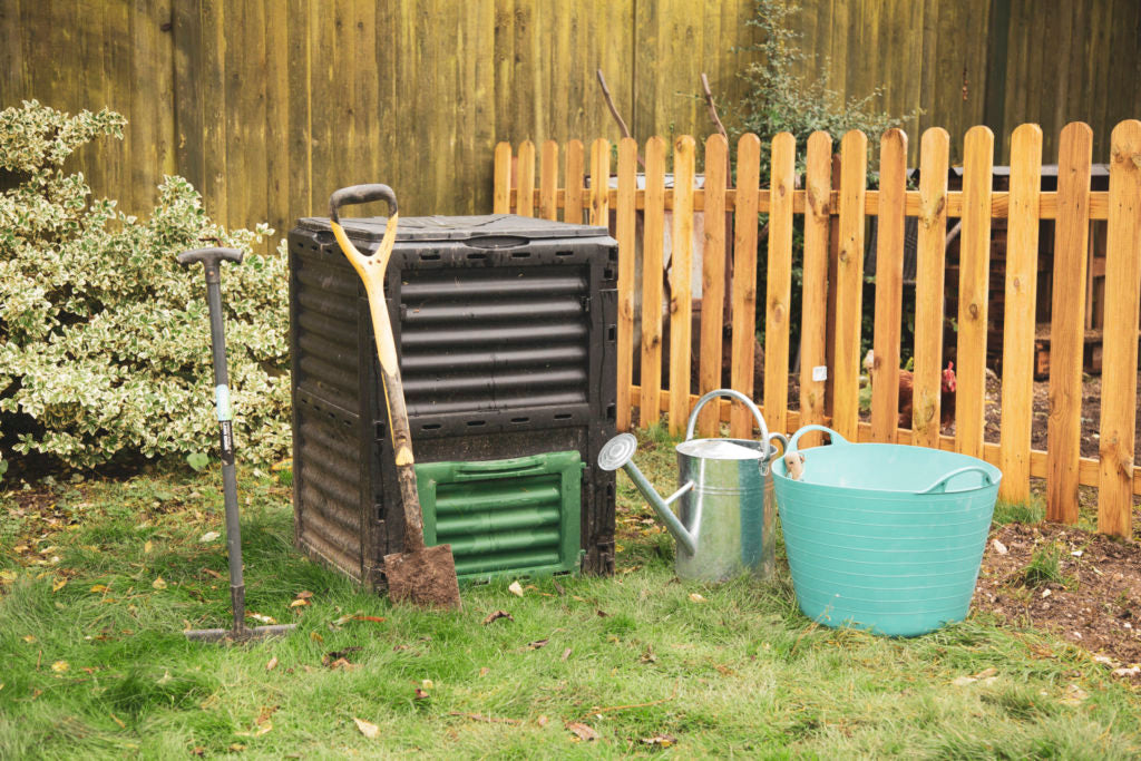 Garden tools and compost bin.