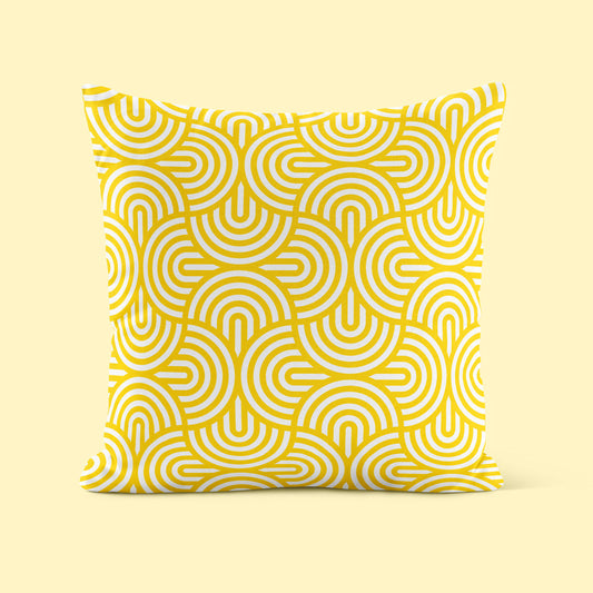 Geometric patterned cushion on yellow background