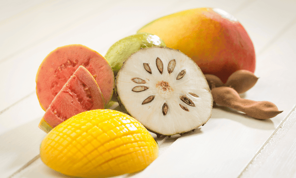 Guava, soursop, mango and tamarind laid on a wooden table