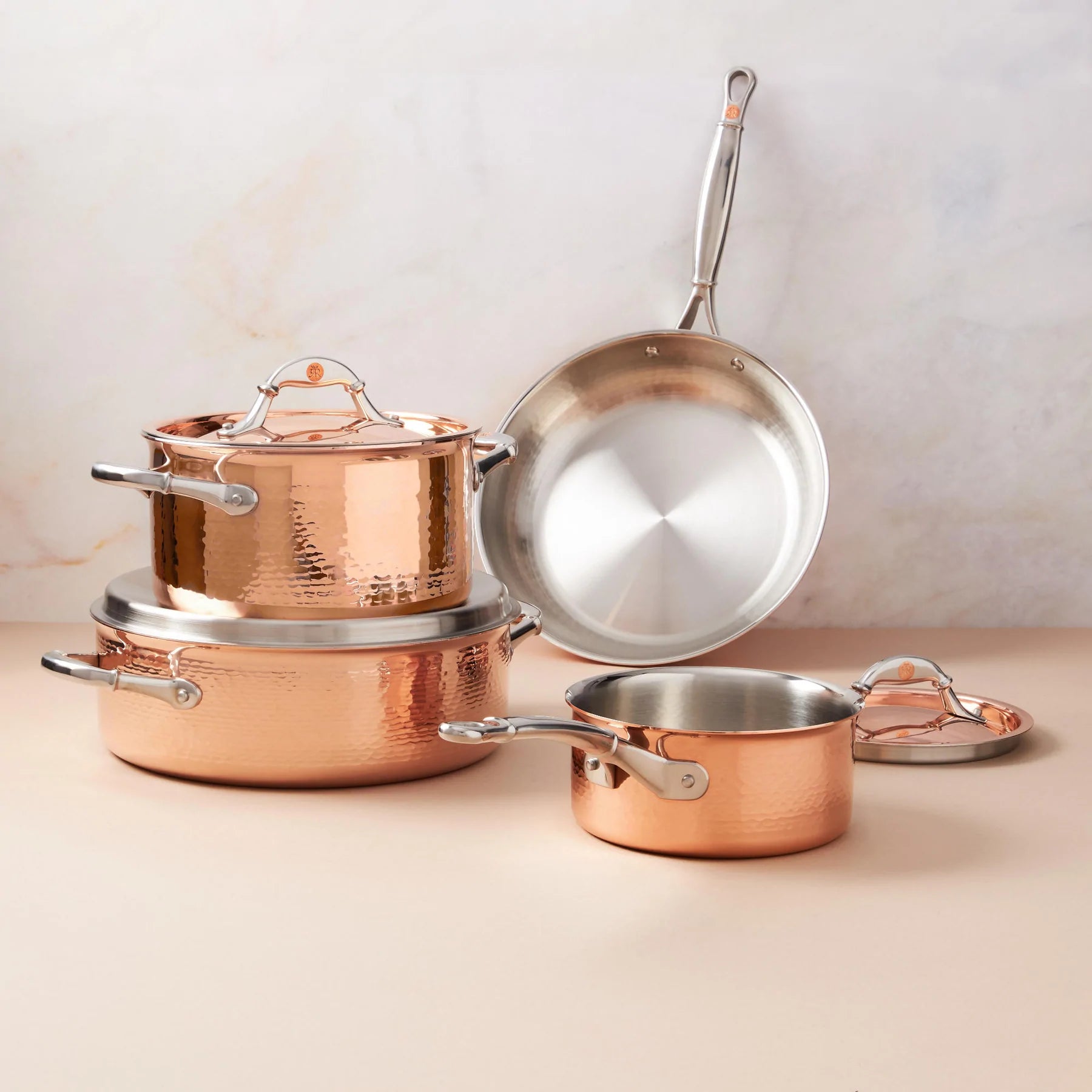 https://cdn.shopify.com/s/files/1/0580/1888/9780/files/Ruffoni-Symphoria-Cupra-7-Piece-Hammered-Copper-Cookware-Set-With-Copper-Clad-Lid-and-Riveted-Stainless-Steel-Handle-Inlaid-With-Signature-Copper-Coin.webp?v=1685838951