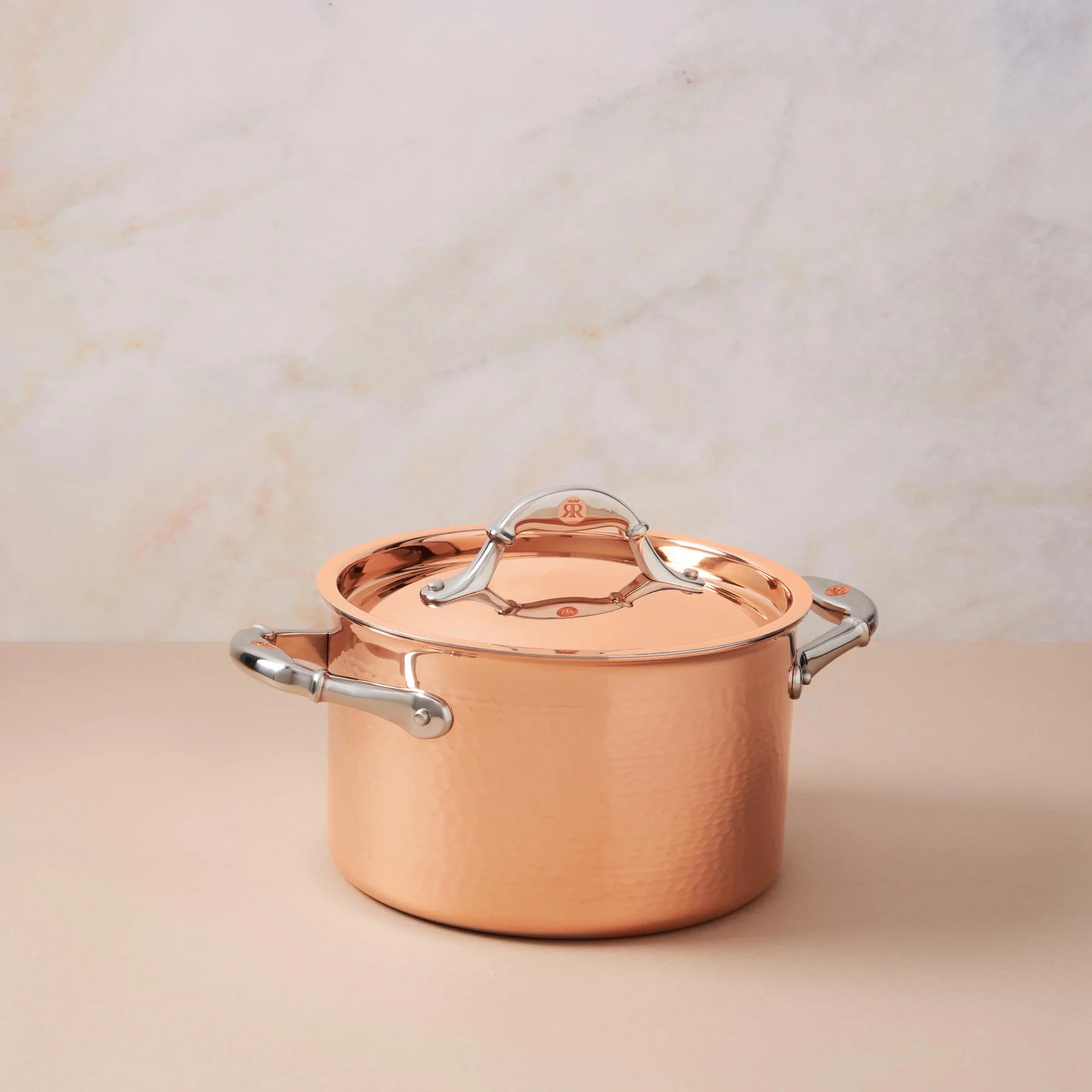 https://cdn.shopify.com/s/files/1/0580/1888/9780/files/Ruffoni-Symphoria-Cupra-8-4-Quart-Hammered-Copper-Soup-Pot-With-Copper-Clad-Lid-and-Riveted-Stainless-Steel-Handle-Inlaid-With-Signature-Copper-Coin.webp?v=1685838903