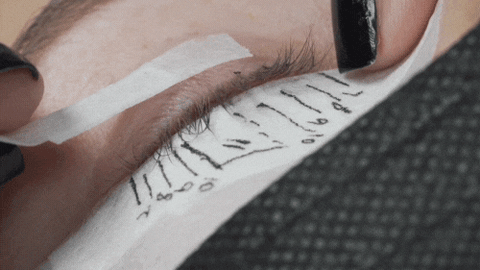 a gif showing the eyelid being pulled across with tape to expose the inner corner lashes