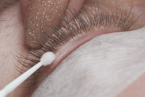 cleansing the lash line with a microfibre brush