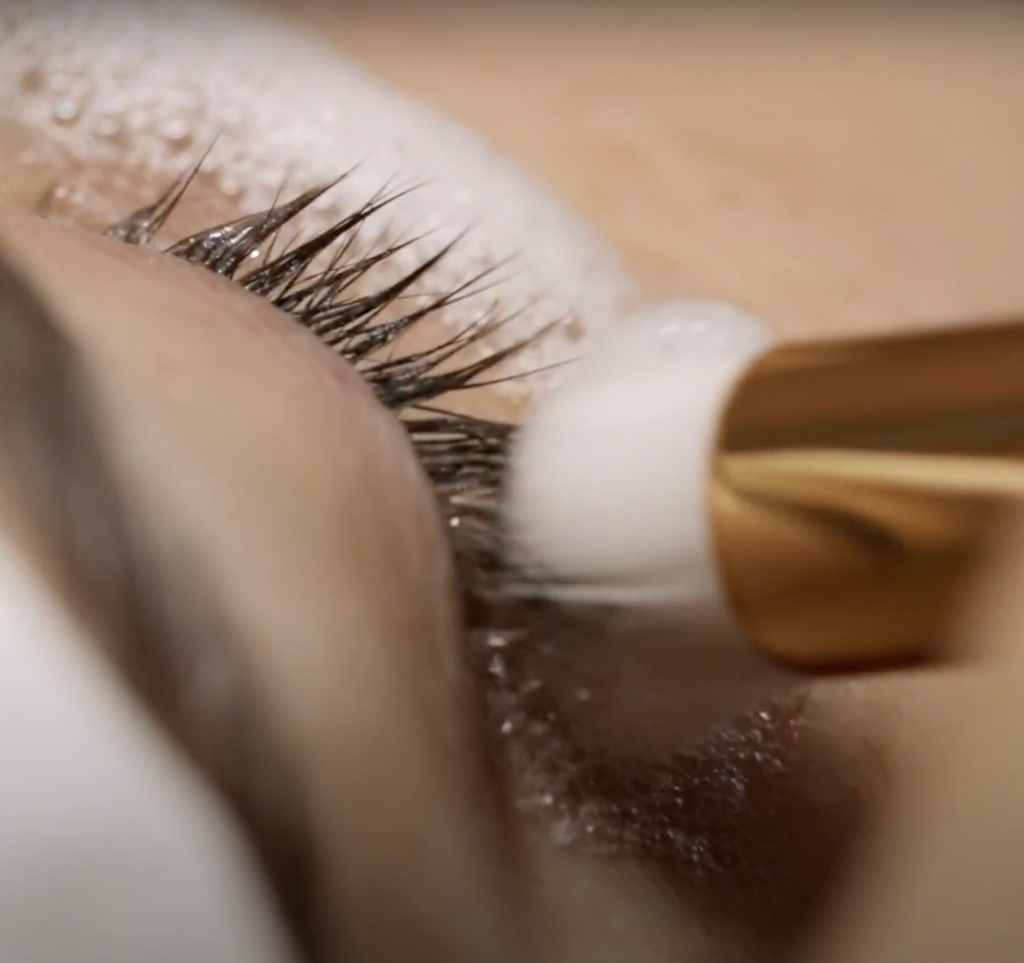 lash shampoo being used for lash extension prep