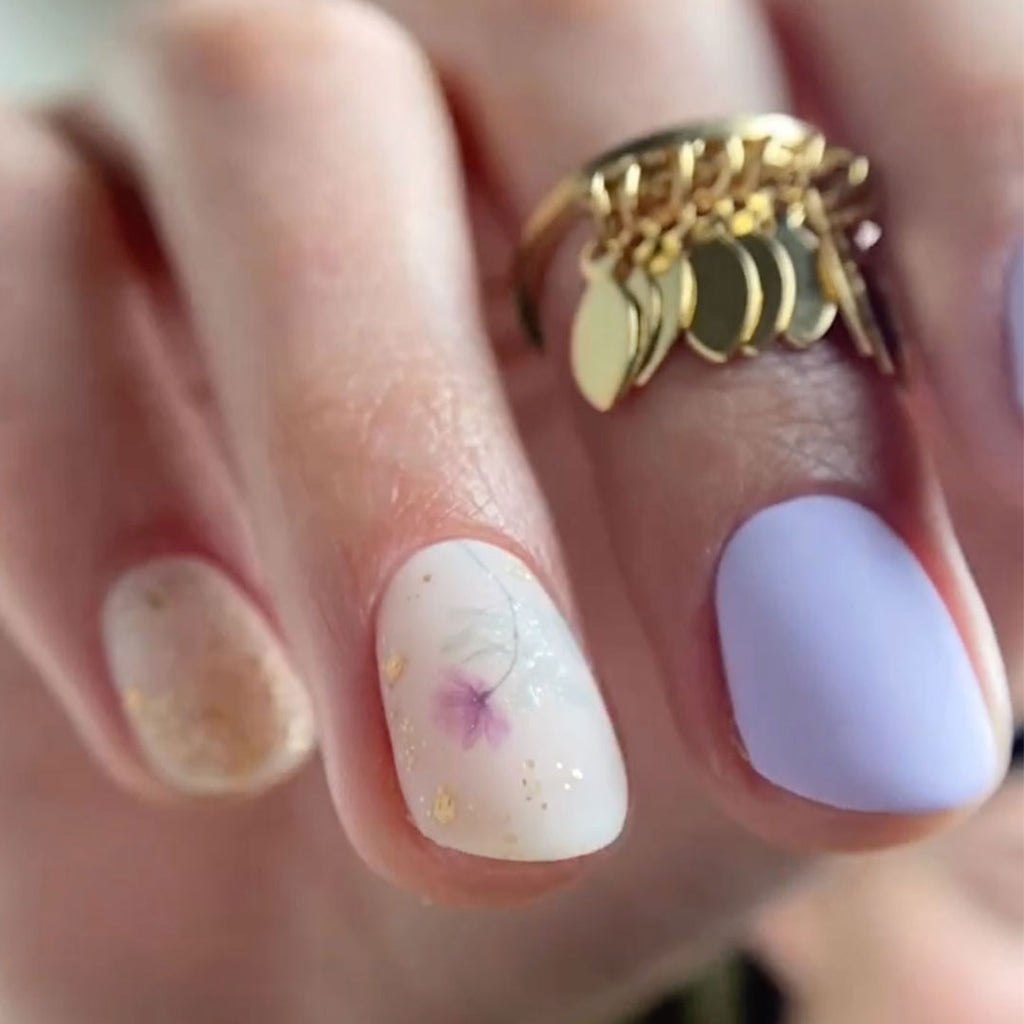 pastel purple gel nails with flower nail art