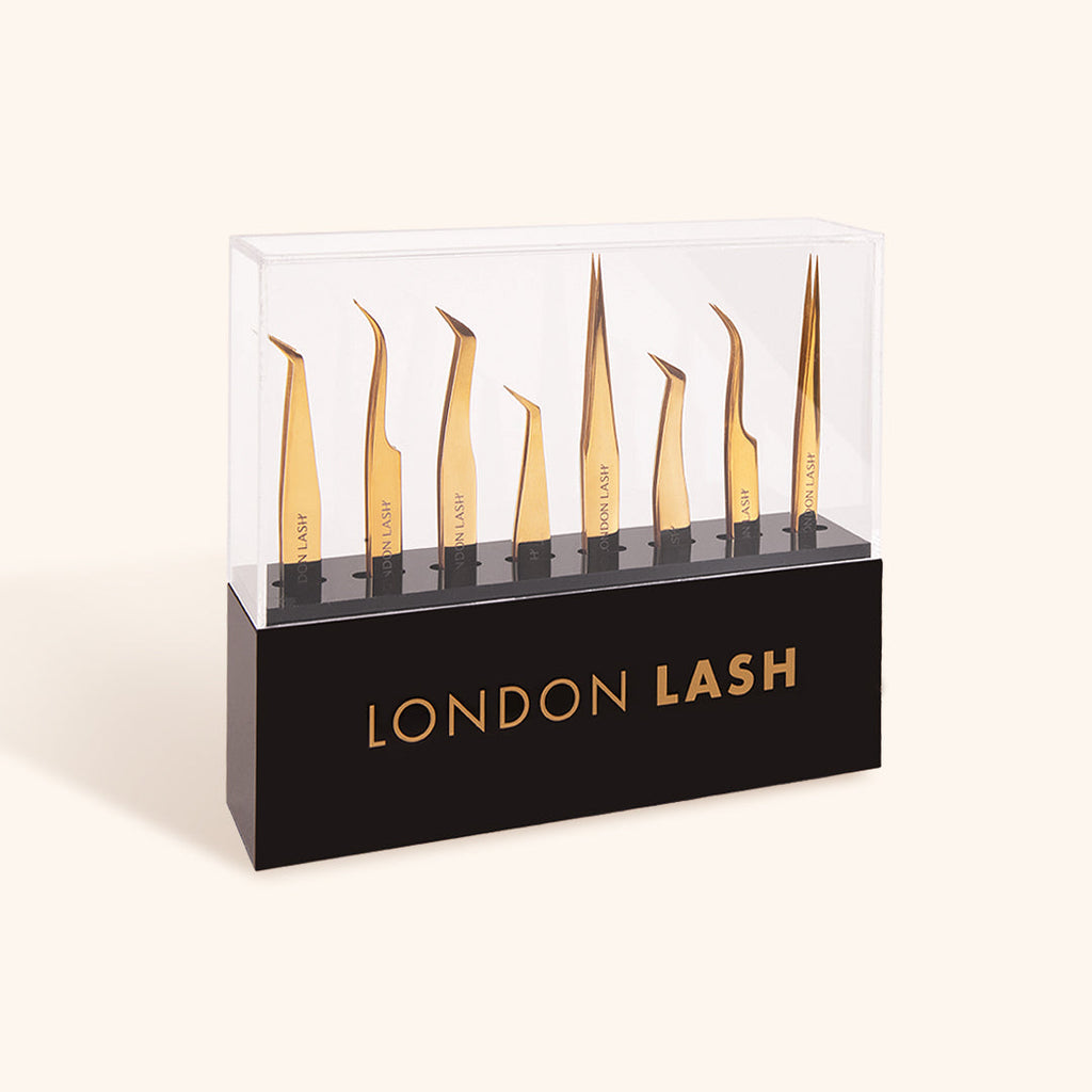 a close up of tweezer storage holding eight different types of lash extension tweezers
