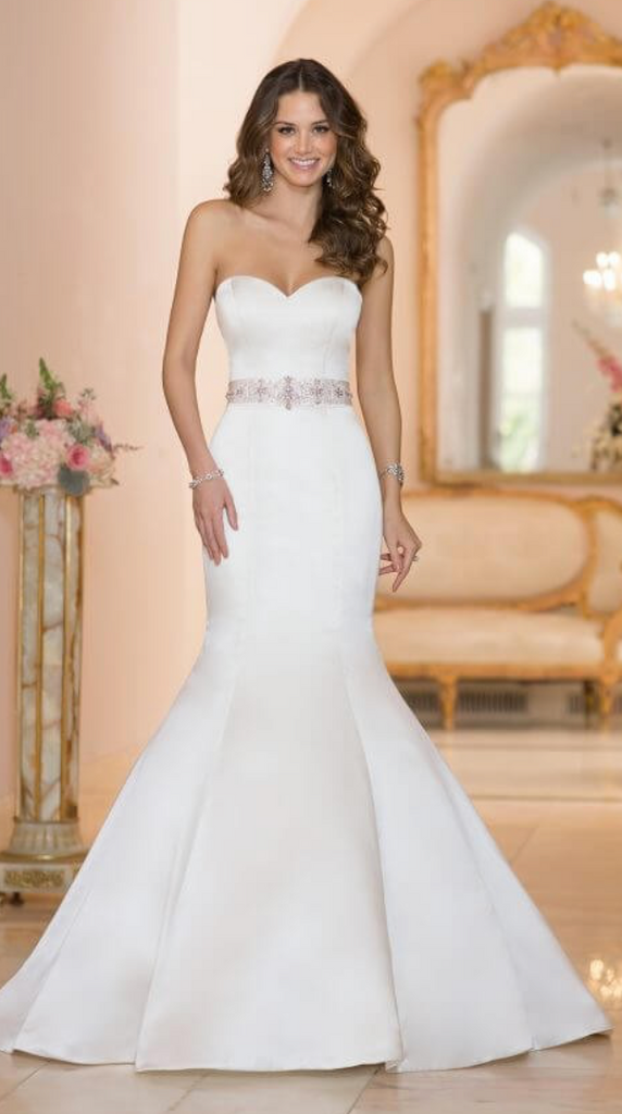 This designer fit-and-flare strapless wedding dress from Stella York is  made from go…