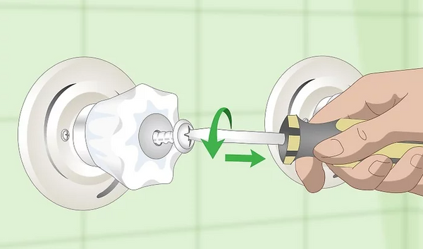 Use a screwdriver to remove the shower handle on the leaking side