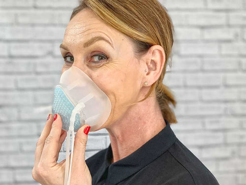 lady holding breathe happy Everyday mask on her face