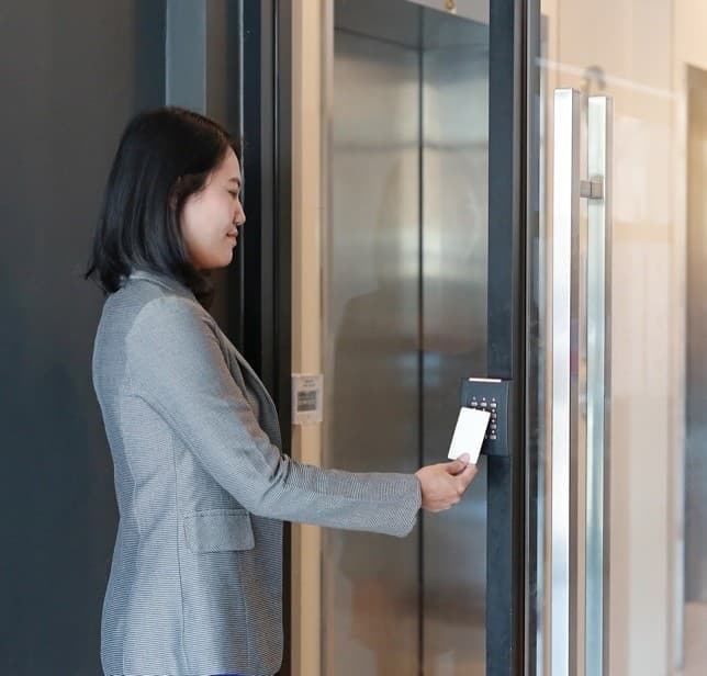 Lady using safentri to enter a building