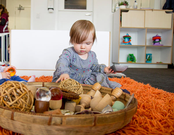 baby playing with objects