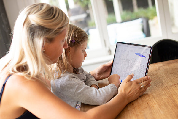 Child drawing on screen