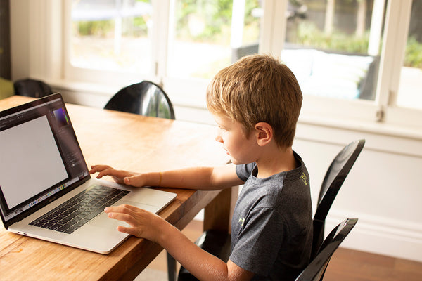 child working on computer