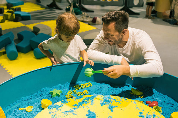 father and son playing together