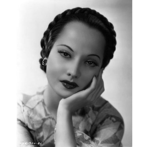 This stunning vintage image of British actress Merle Oberon is printed on archival-grade canvas. It captures her unique beauty and strength, recalling her magnificent roles in iconic films like The Private Life of Henry VIII, The Scarlet Pimpernel, and Wuthering Heights. A timeless piece, Oberon's image will bring a touch of nostalgia and sophistication to any room for years to come.