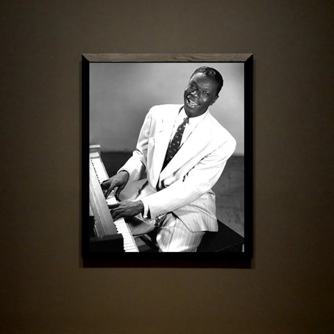 Featuring an iconic monochrome vintage image of Nat King Cole, this canvas is a perfect way to honor the legendary jazz and pop vocalist and actor. His career spanned nearly 30 years, with over 100 hit songs filling the pop charts. Commemorate his timeless music with an elegant tribute.