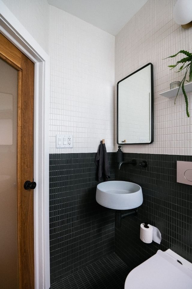 The black and white colour scheme was meticulously planned with minimal fixtures and shelving - all of which do not touch the floor.  Surrounded by strong angles and refined styling our funl basin in powder blue has been wall mounted- taking up minimal space but making maximum impact.  We love the bathroom design so much, we had to share it with you all.