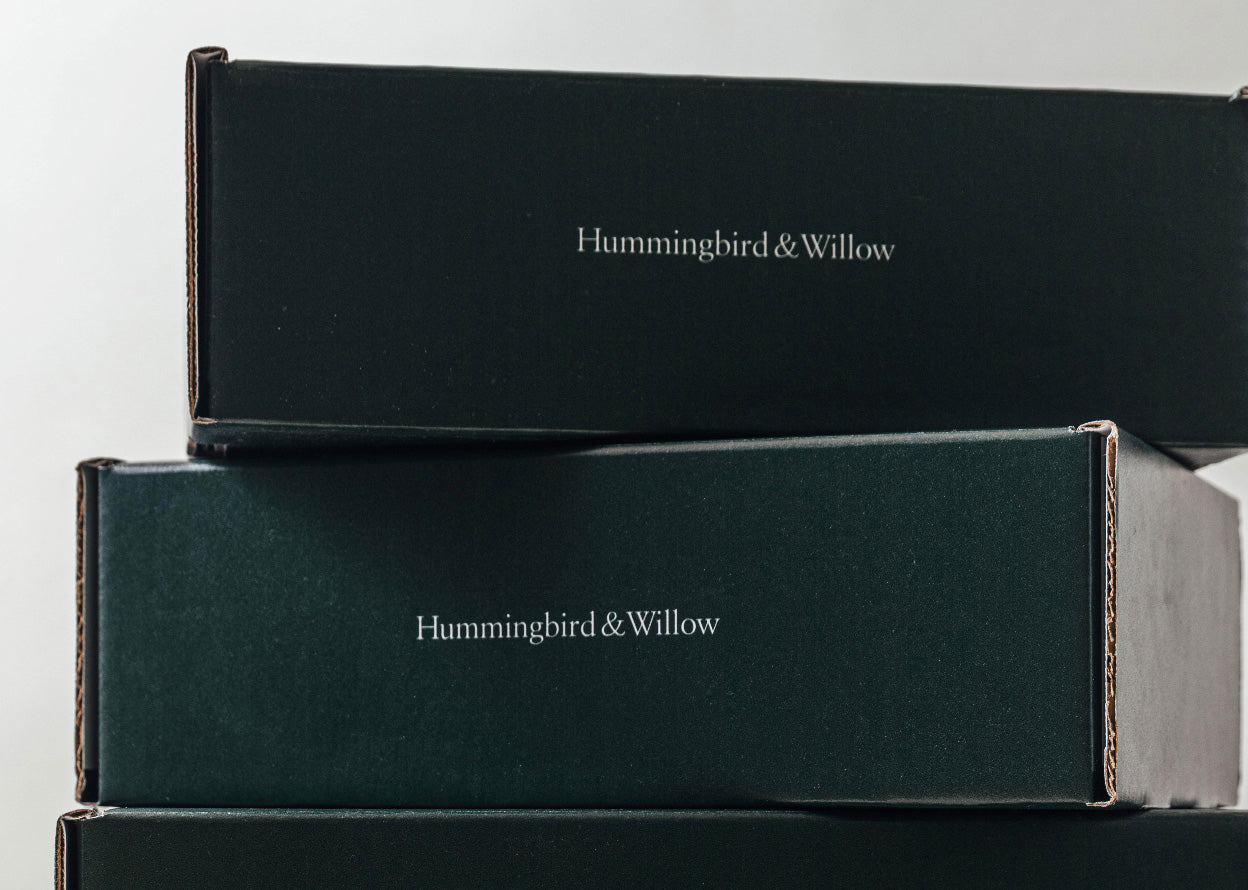 Stacked shipping boxes with Hummingbird & Willow written on the side