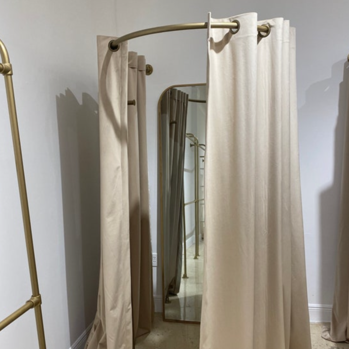 Curved fitting room curtain rods – Andi's List