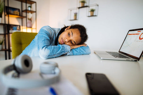 Woman resting on a table